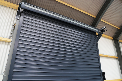 A commercial door prior to planned maintenance